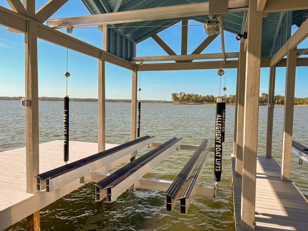 A dock with several metal posts and a pier.